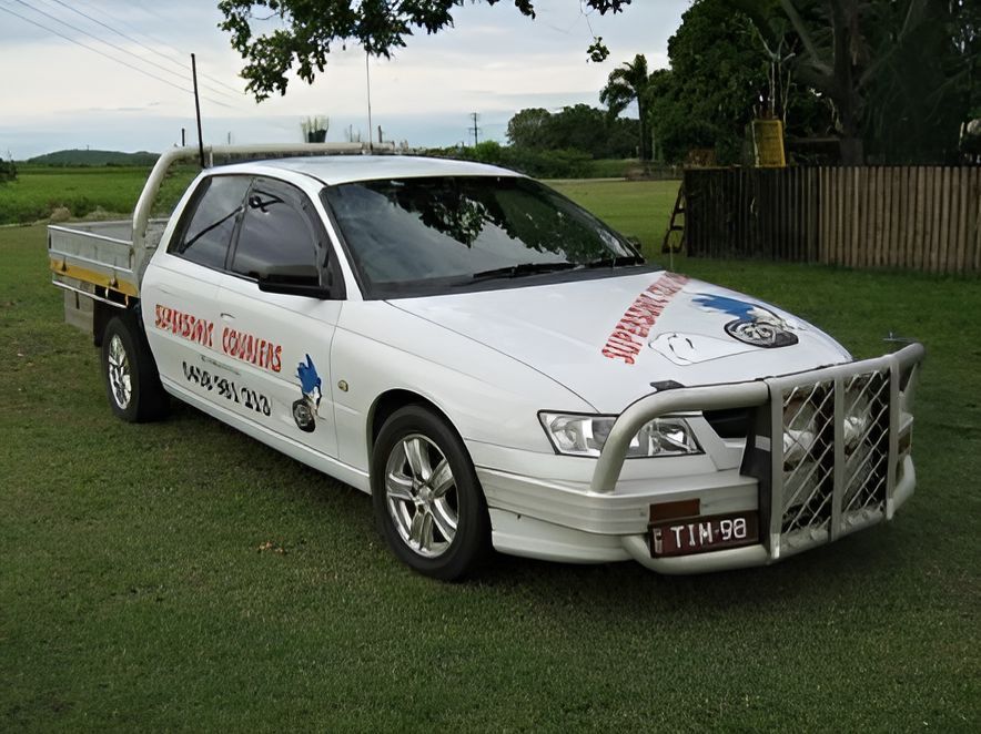 A White Car With a License Plate — Supersonic Couriers In West Mackay, QLD