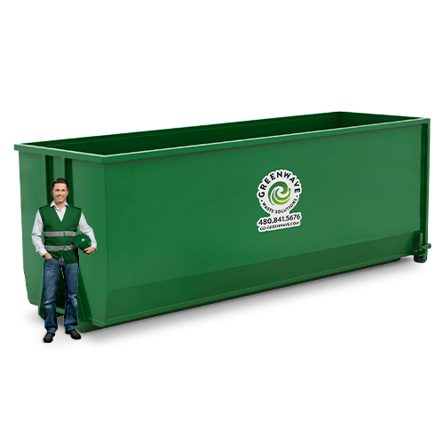 A man is standing next to a green dumpster with the number 40 on it.
