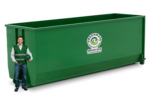 A man is standing next to a green dumpster with the number 40 on it.