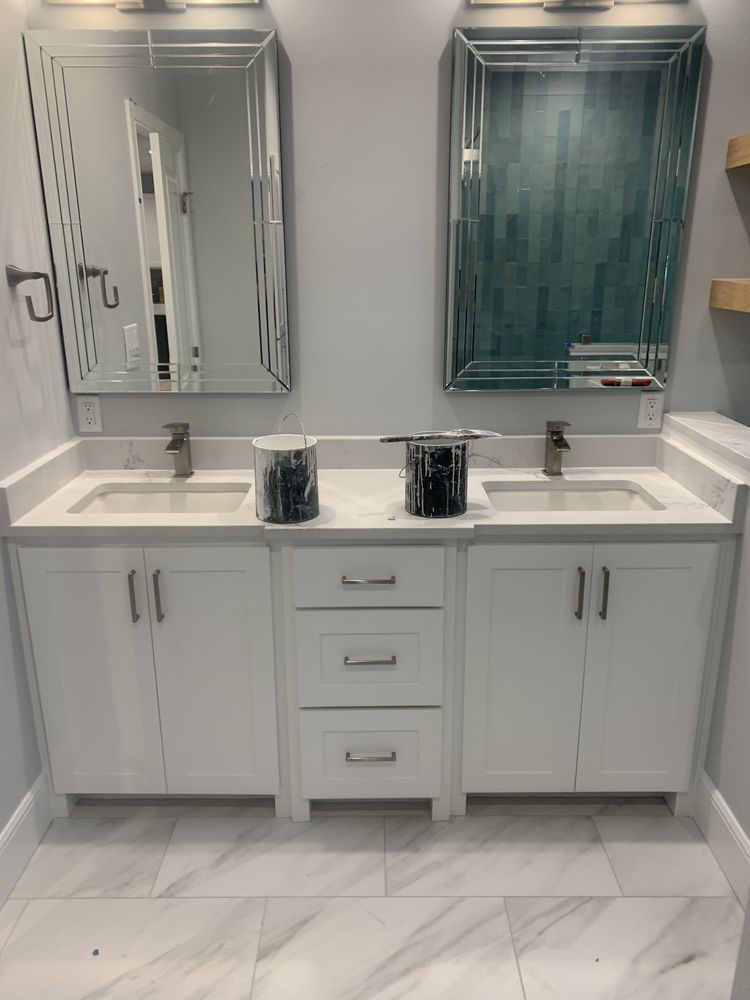 Modern white double vanity bathroom with twin mirrors and marble-look tile floor