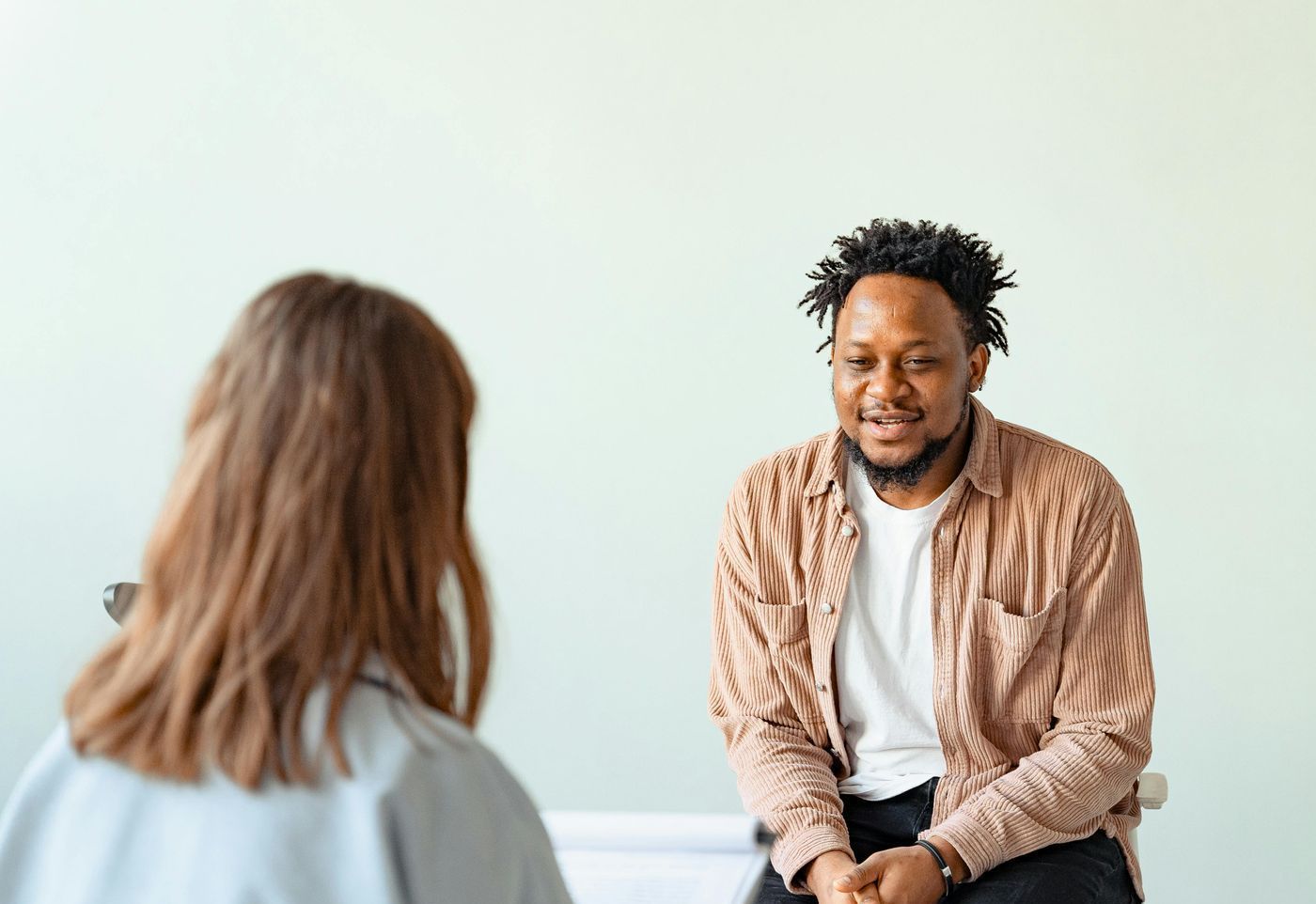 Private counselling session between therapist and client.