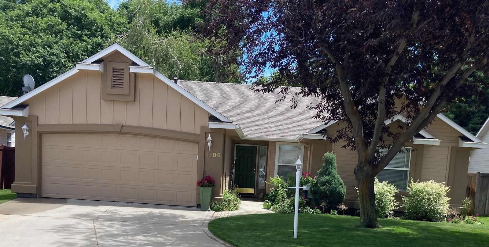 Big House with garage door — Caldwell, ID — Busy Bee Painting