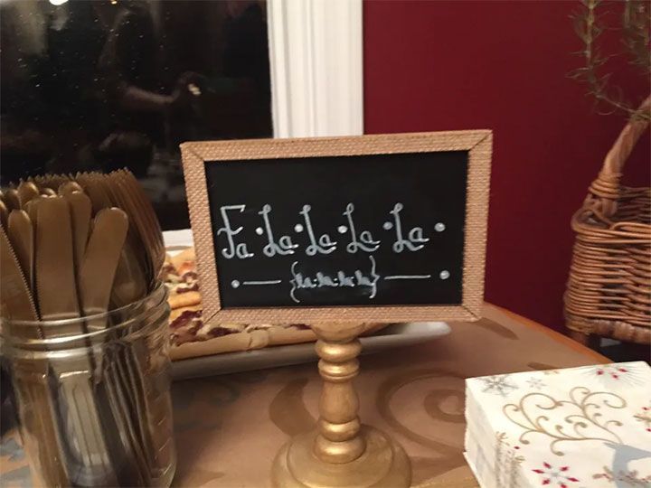 chalkboard with the words fa la la la written on it