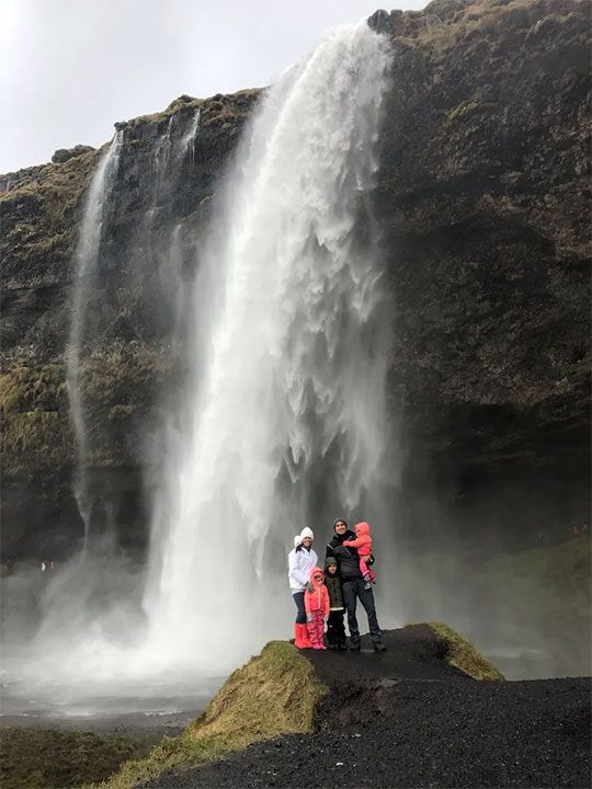 family at waterfall