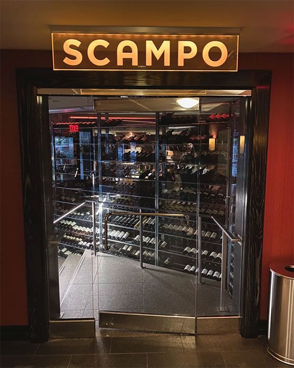 scampo written on glass door