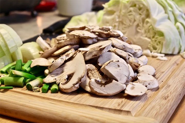 mushrooms cabbage and green onions on it