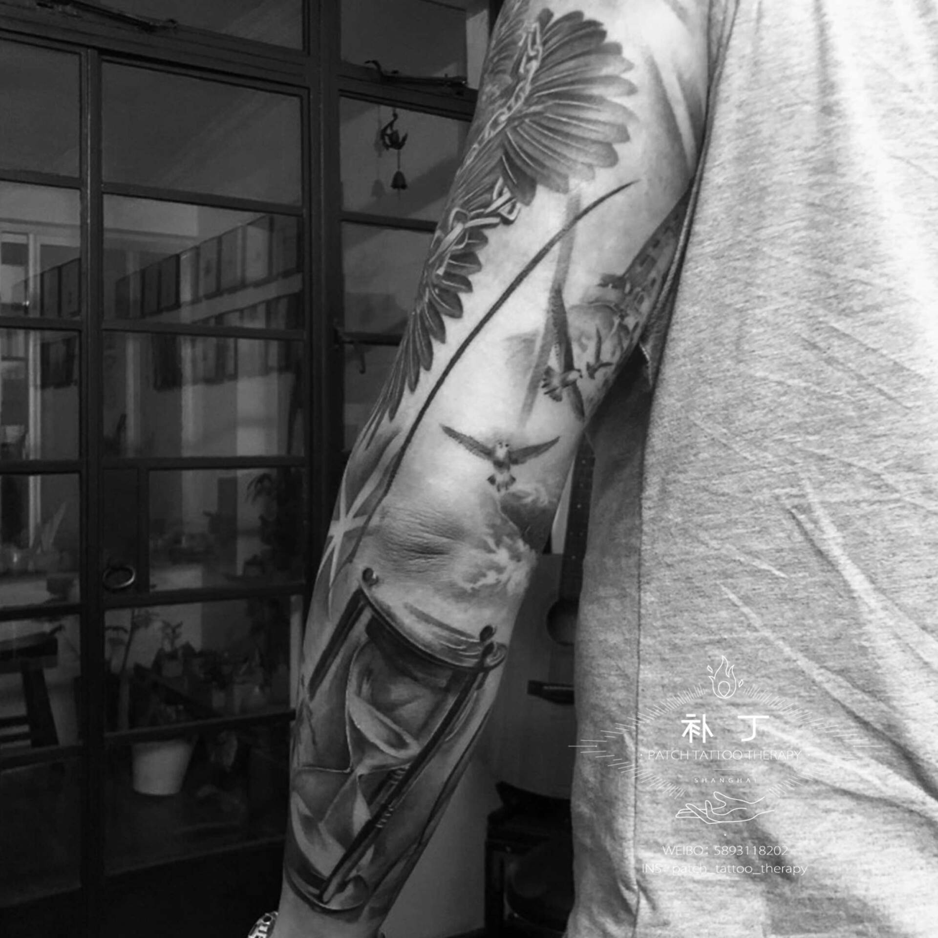 Full arm tattoo sleeve feature a bird, ship boat, hourglass, and clock in grey and grey realistic style designed by Jingxi Gu at Patch Tattoo Therapy - angle 3