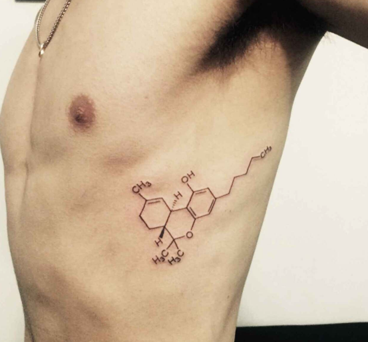 Side rib tattoo of a chemistry bond structure in geometric style designed by Jingxi Gu at Patch Tattoo Therapy