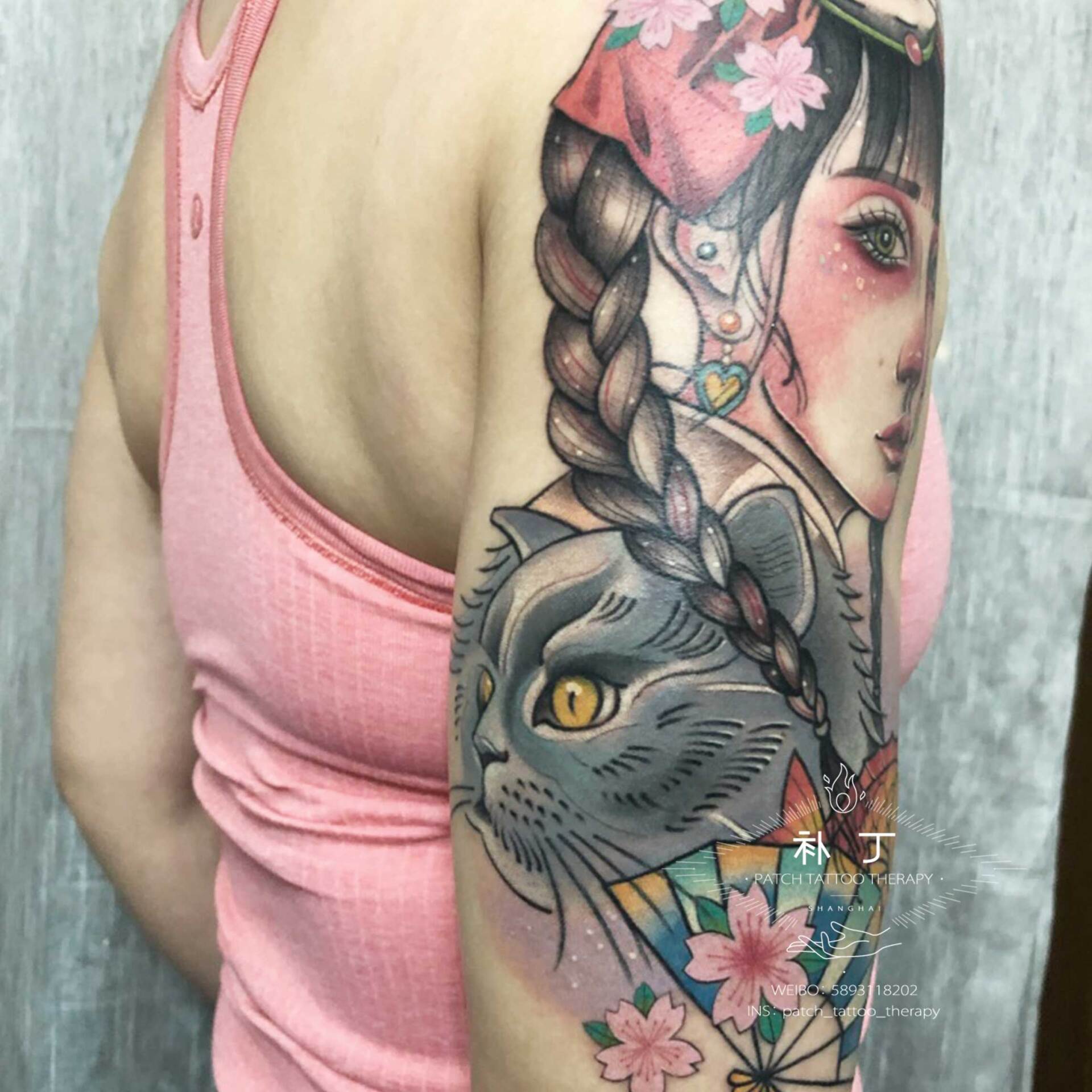 Outside arm tattoo of a daughter with her cats, fan, and fish done in Japanese color style designed by Jingxi Gu at Patch Tattoo Therapy - angle 2