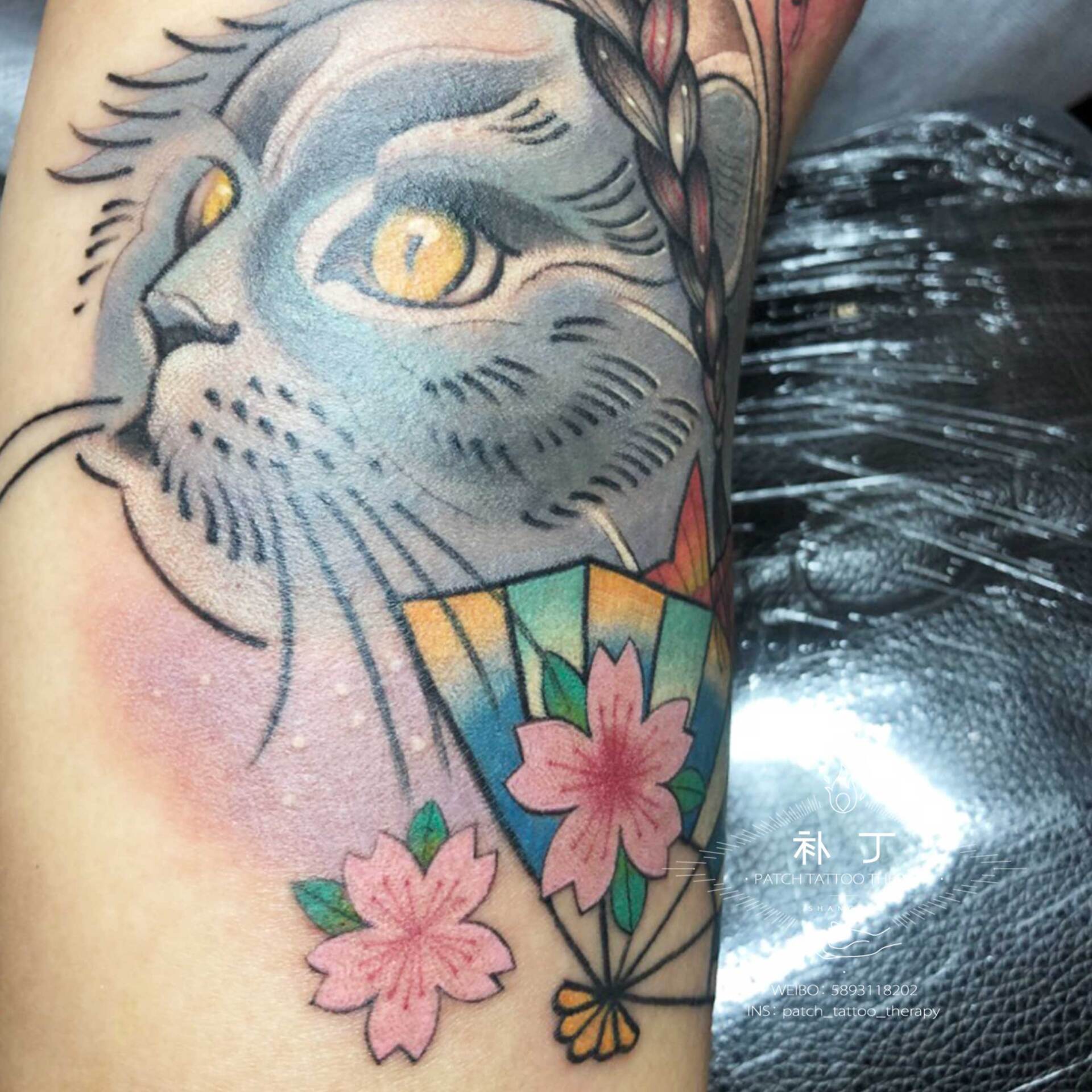 Outside arm tattoo of a daughter with her cats, fan, and fish done in Japanese color style designed by Jingxi Gu at Patch Tattoo Therapy - angle 3