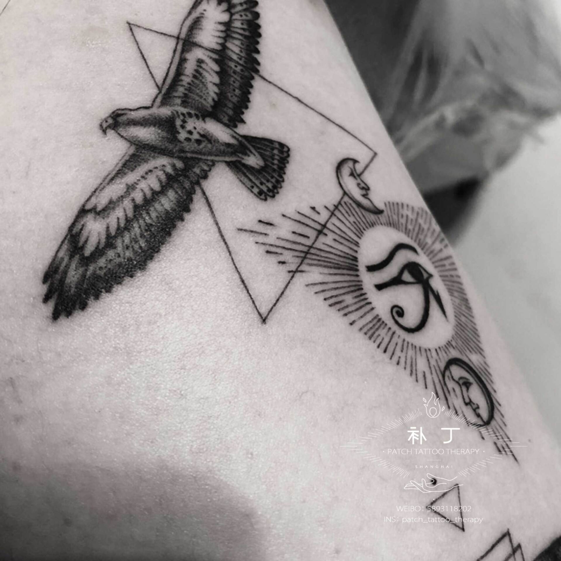 Inner arm egyptian collage tattoo featuring nehebkau the snake god, the eye of providence, the eye of horus, the sun, and a bird in geometric style designed by Jingxi Gu at Patch Tattoo Therapy - angle 3