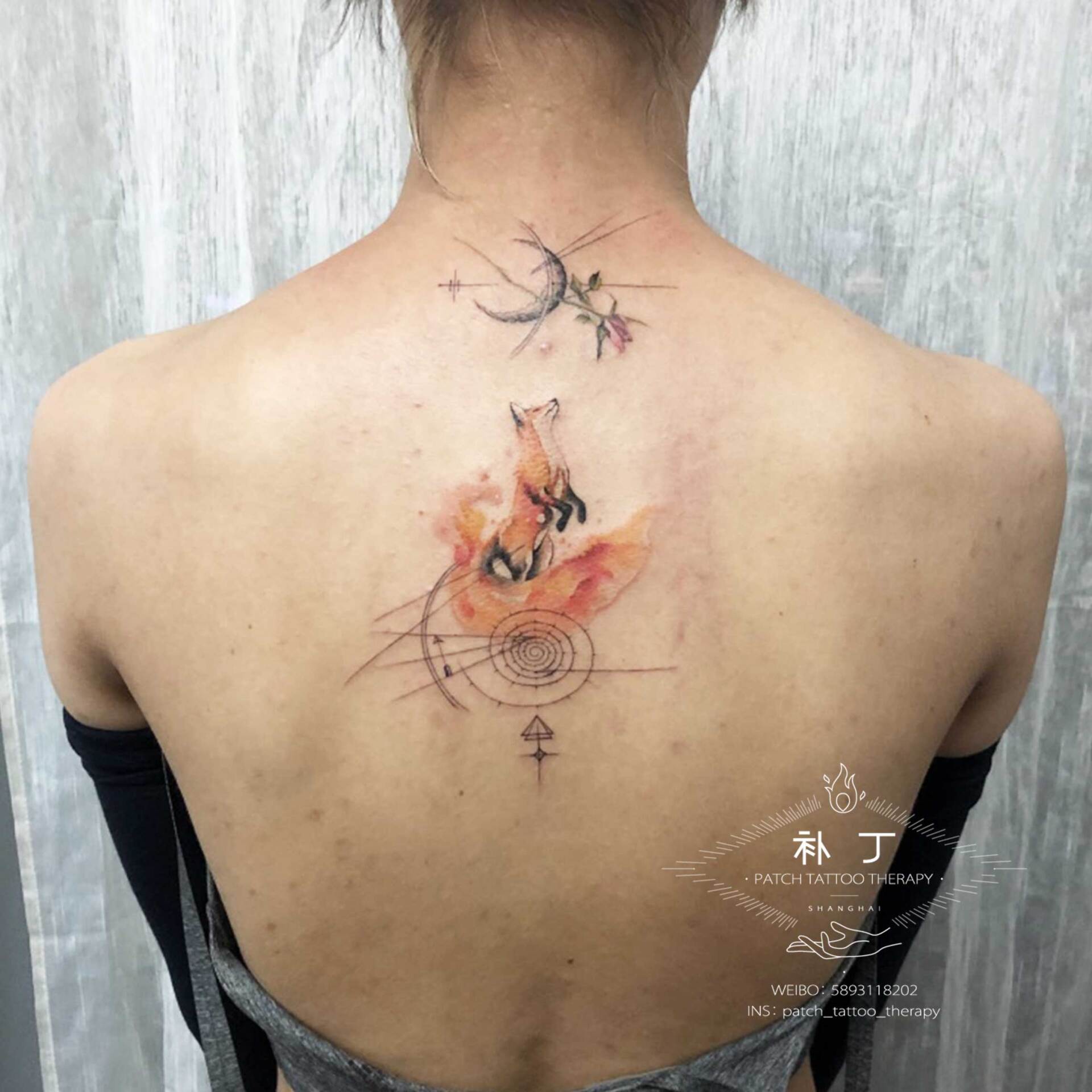 Back tattoo of a fox on two legs reach for the moon in color designed by Jingxi Gu at Patch Tattoo Therapy - angle 1