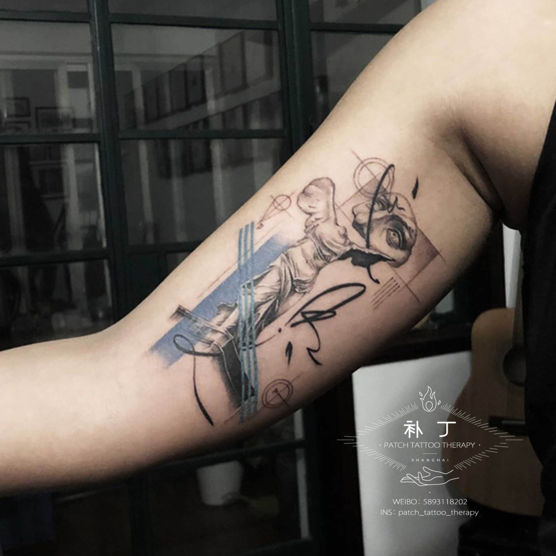 Inner arm tattoo of a broken greek statue in geometric style with some color designed by Jingxi Gu at Patch Tattoo Therapy