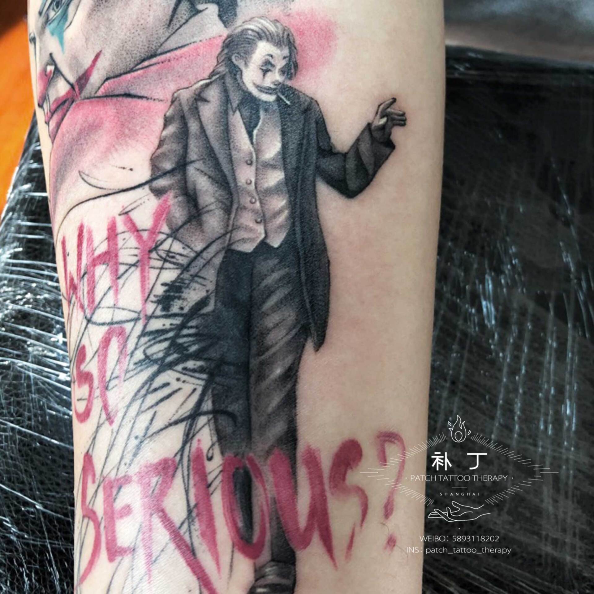 Inner forearm tattoo of Joker portrait and walking Joker with words Why So Serious in painting styled color designed by Jingxi Gu at Patch Tattoo Therapy - angle 2