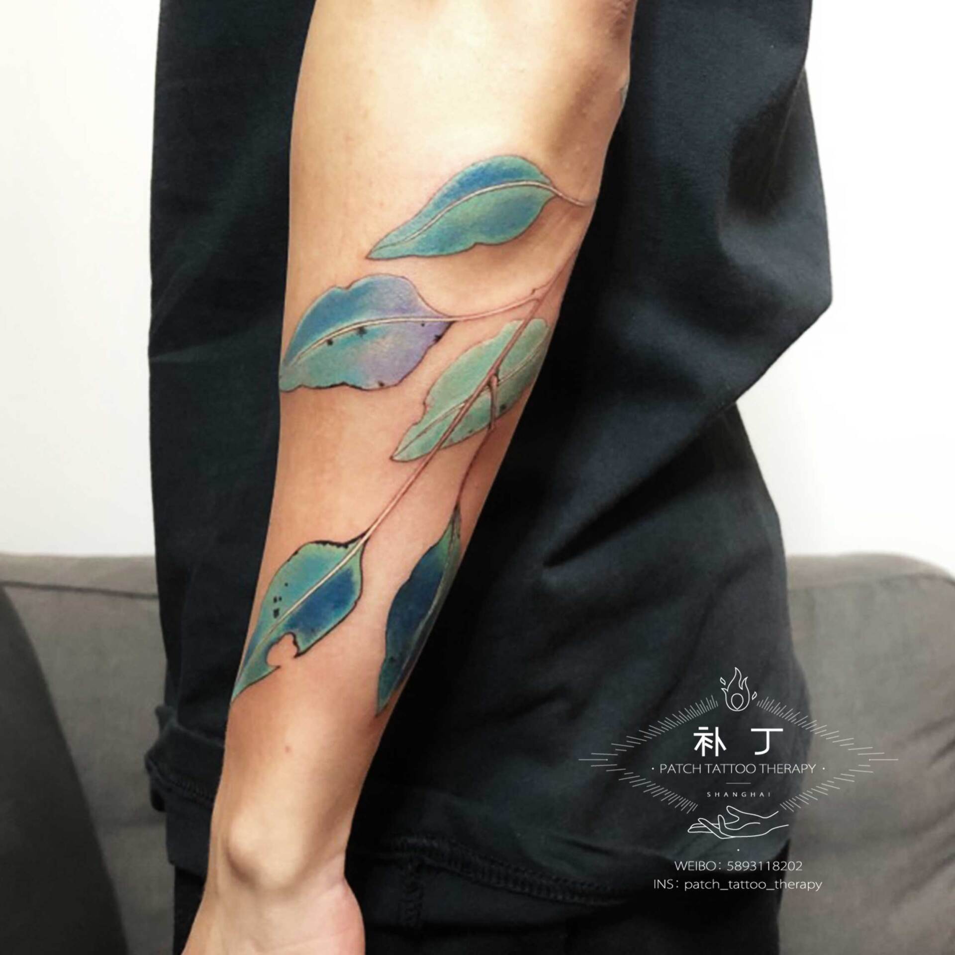Forearm sleeve of turquoise leaves in Chinese Painting style designed by Jingxi Gu at Patch Tattoo Therapy - angle 2