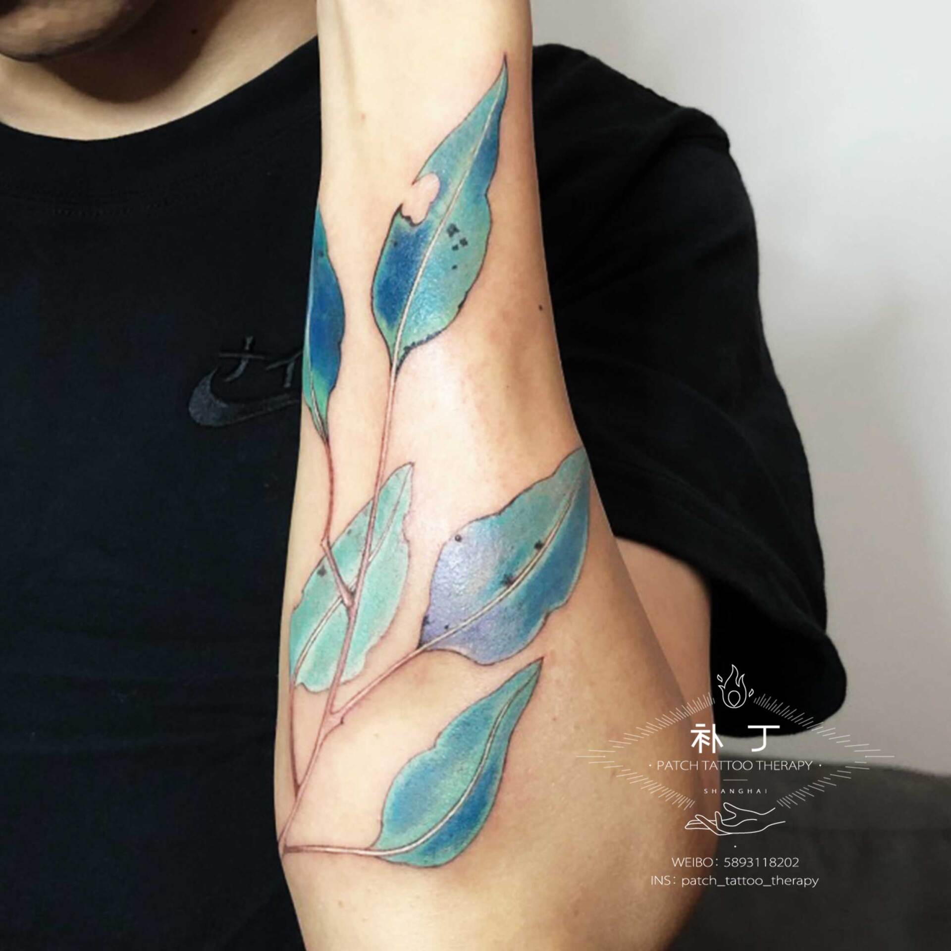 Forearm sleeve of turquoise leaves in Chinese Painting style designed by Jingxi Gu at Patch Tattoo Therapy - angle 3