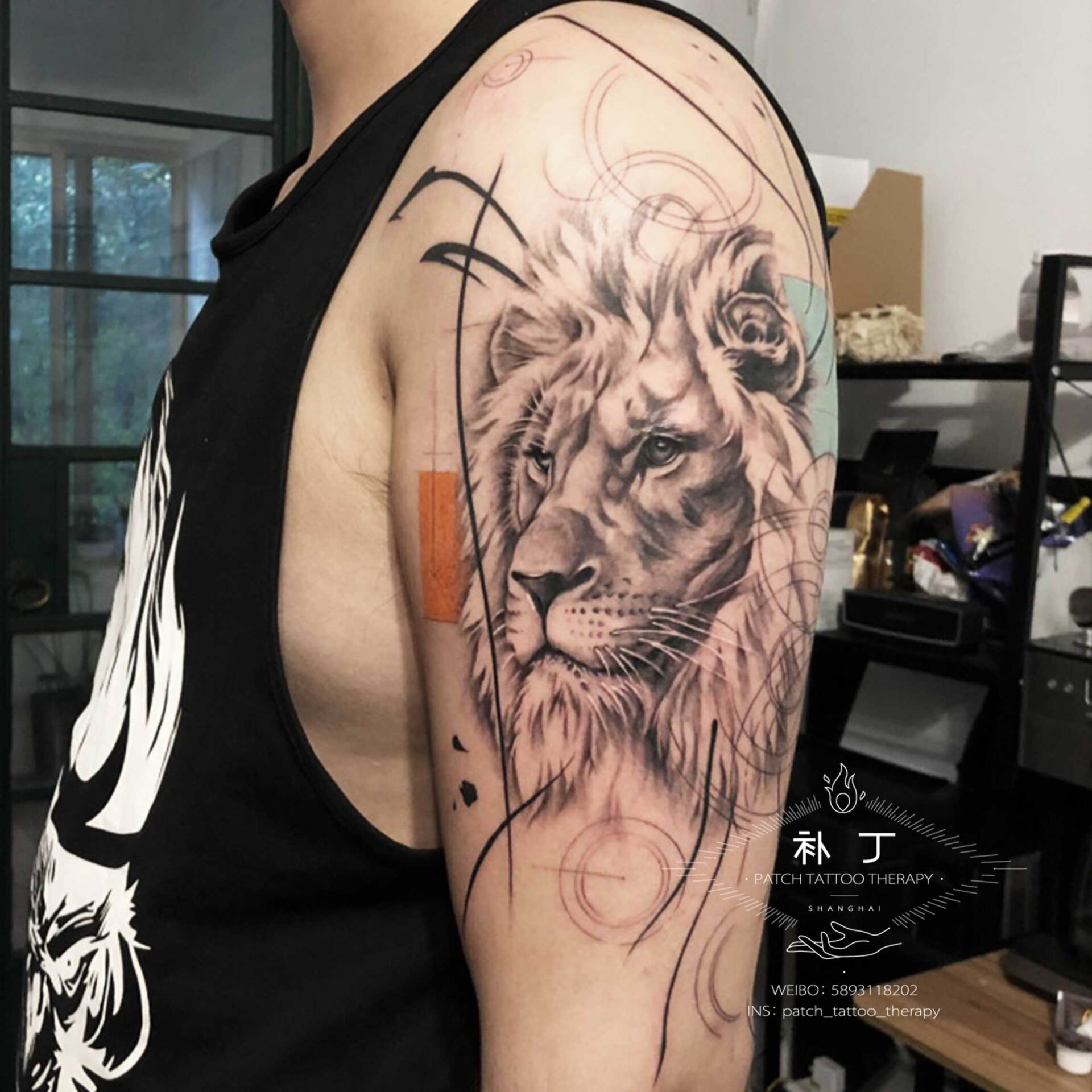 Outside arm tattoo of a Lion portrait with shapes in geometric style with some color designed by Jingxi Gu at Patch Tattoo Therapy - angle 2