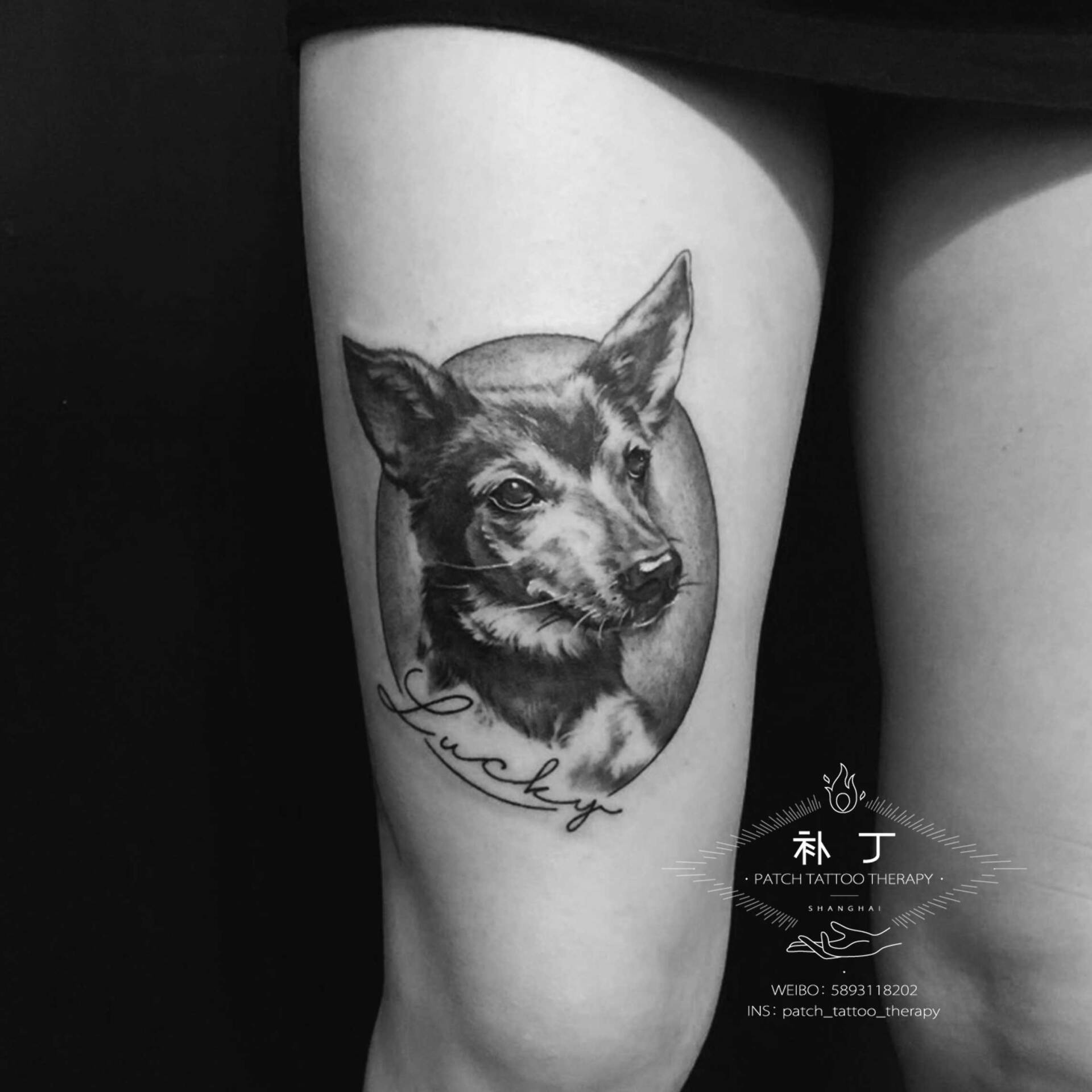 Thigh leg tattoo of Lucky the Dog with text in black and grey realistic style designed by Jingxi Gu at Patch Tattoo Therapy