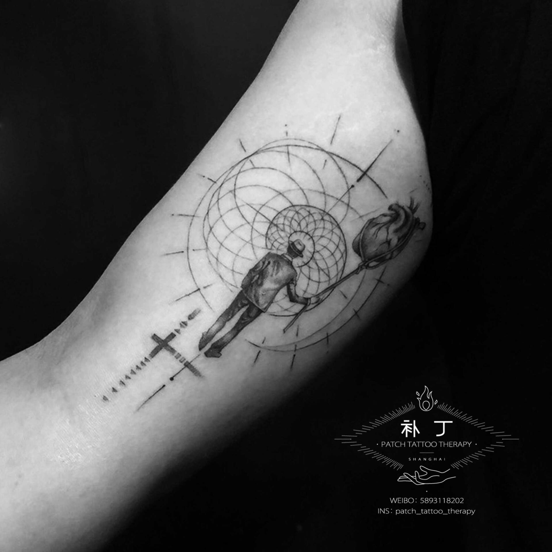 Inner arm tattoo of a man holding onto a rope wrapped around a heart floating like a balloon while walking into a chochlea spiral shape in geometric style designed by Jingxi Gu at Patch Tattoo Therapy