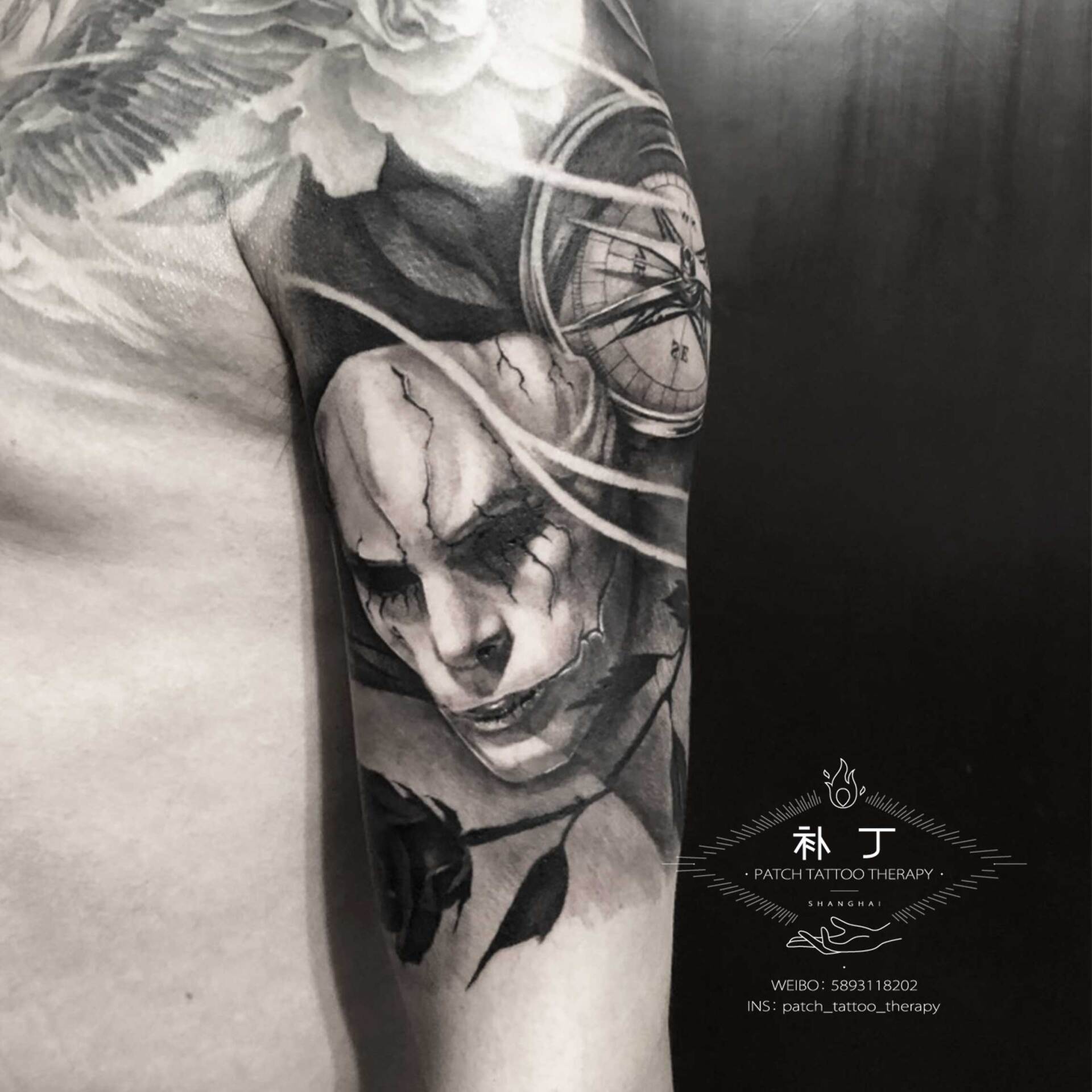 Half upper arm sleeve tattoo of a masked man, clock and rose in black and grey realistic style designed by Jingxi Gu at Patch Tattoo Therapy - angle 3