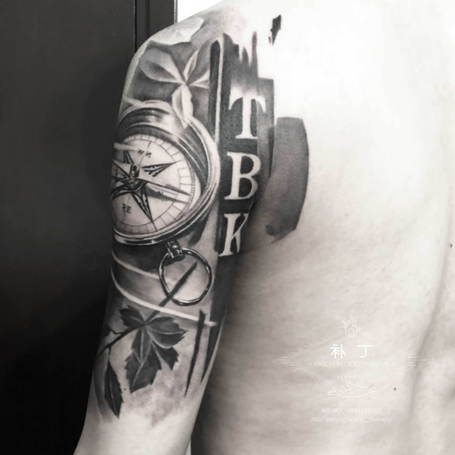 Half upper arm sleeve tattoo of a masked man, clock and rose in black and grey realistic style designed by Jingxi Gu at Patch Tattoo Therapy - angle 4