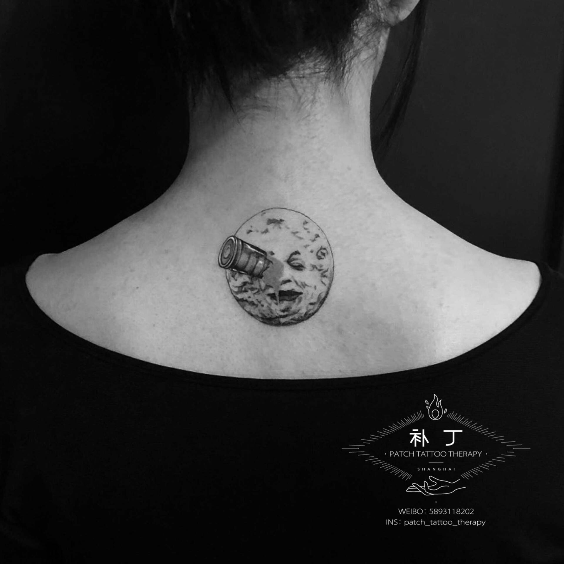 Back tattoo of the le voyage dans la lune cover depicting a moon with a telescope in the eye designed by Jingxi Gu at Patch Tattoo Therapy