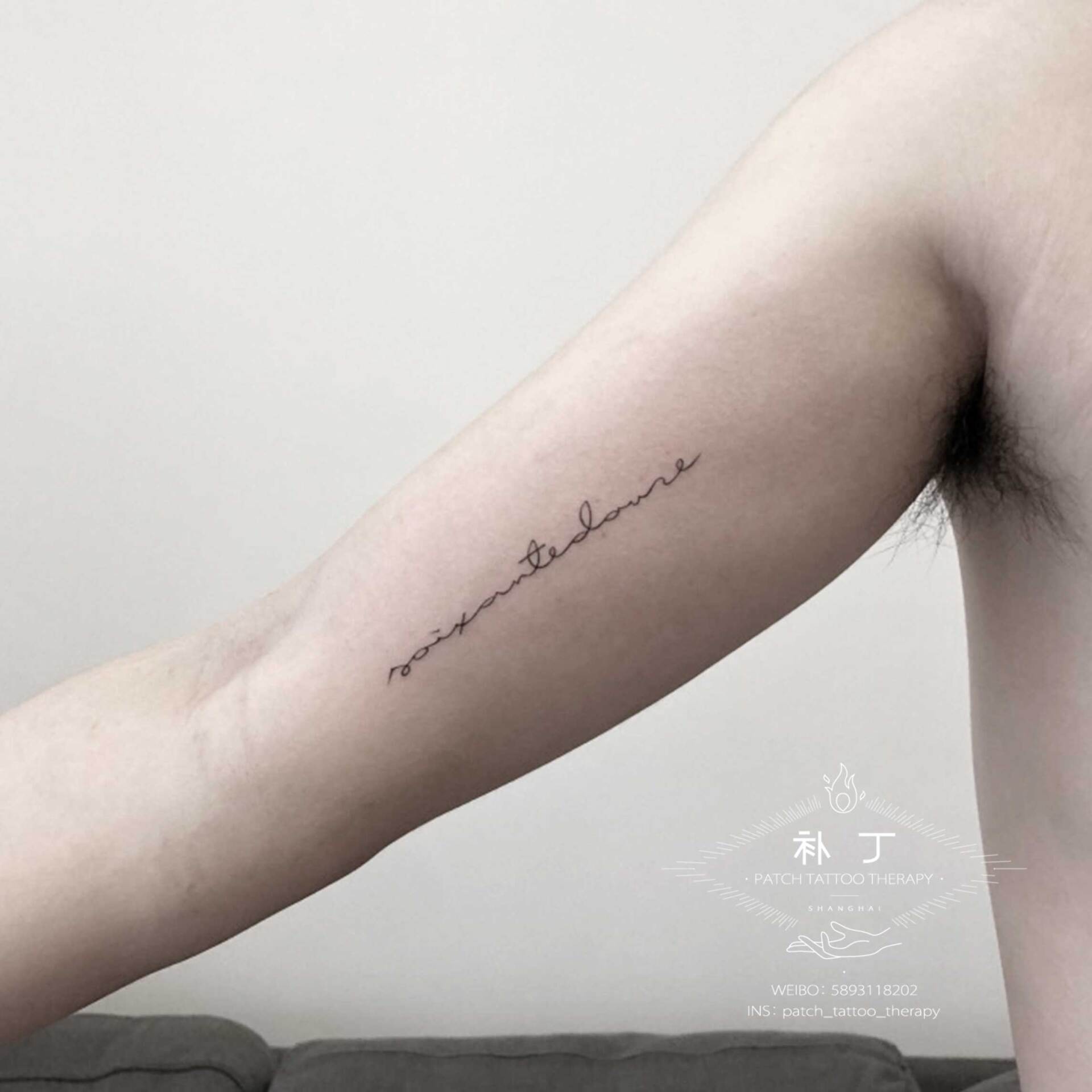 Forearm tattoo of letters designed by Jingxi Gu at Patch Tattoo Therapy - angle 1