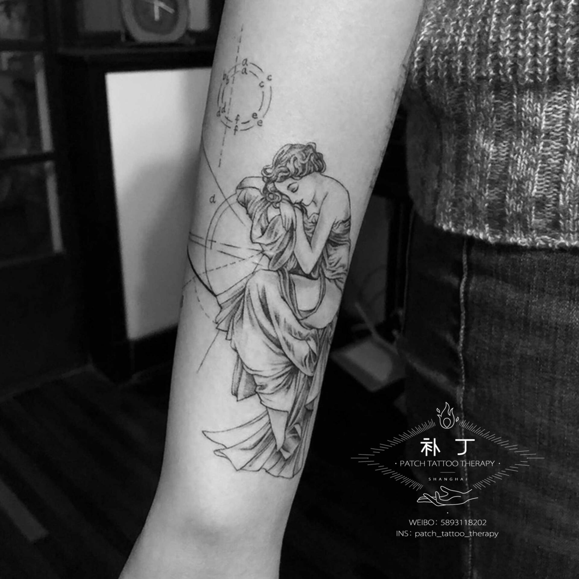 Forearm tattoo of Mucha Greek Tragedy in geometric style designed by Jingxi Gu at Patch Tattoo Therapy