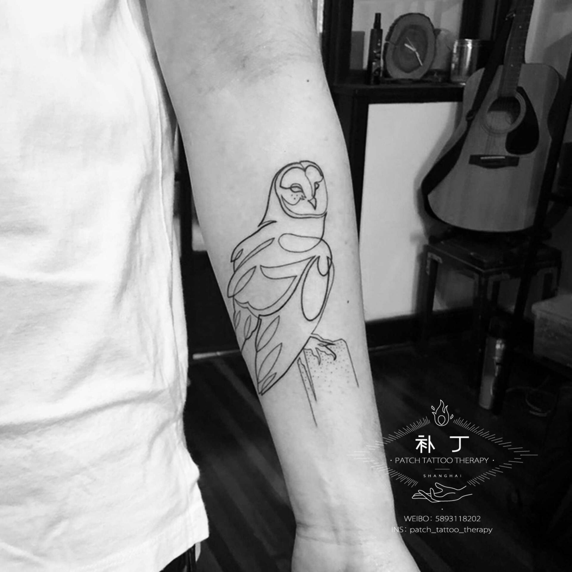 Inner forearm owl outline tattoo designed by Jingxi Gu at Patch Tattoo Therapy