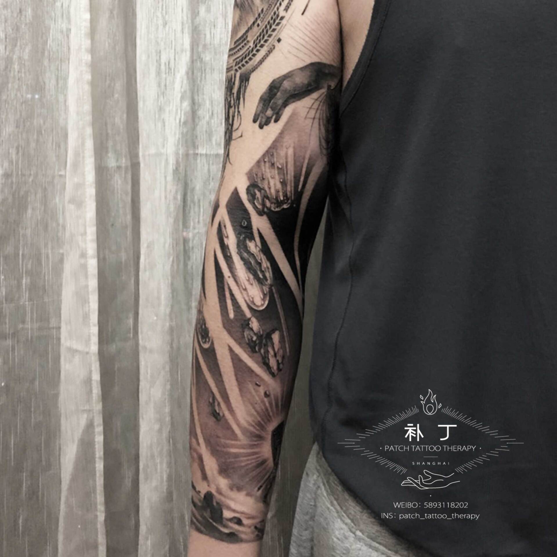 Full arm sleeve featuring a man fighting off meteors and comets with a lion portrait on the shoulder in black and grey realistic style designed by Jingxi Gu at Patch Tattoo Therapy - angle 2