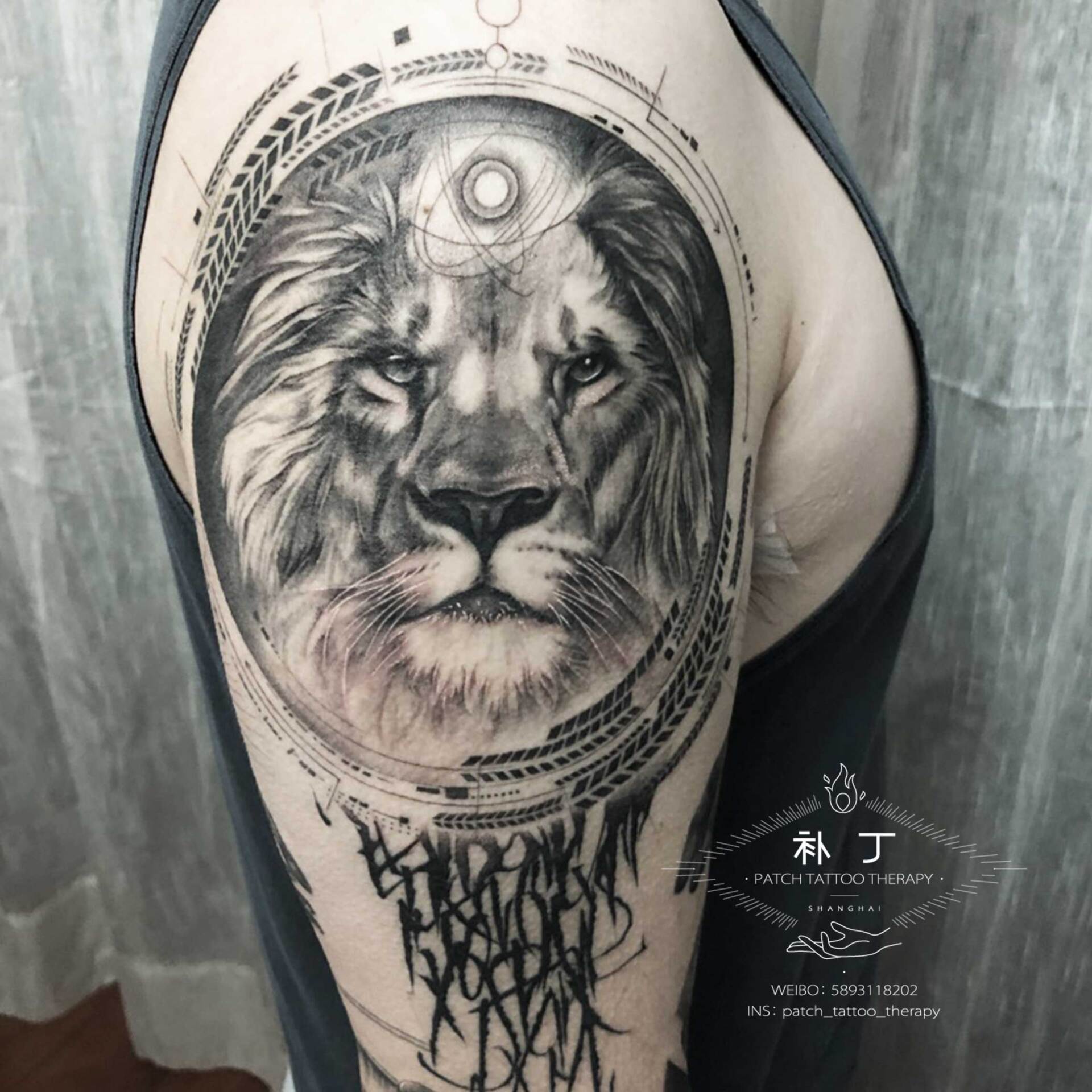 Full arm sleeve featuring a man fighting off meteors and comets with a lion portrait on the shoulder in black and grey realistic style designed by Jingxi Gu at Patch Tattoo Therapy - angle 3