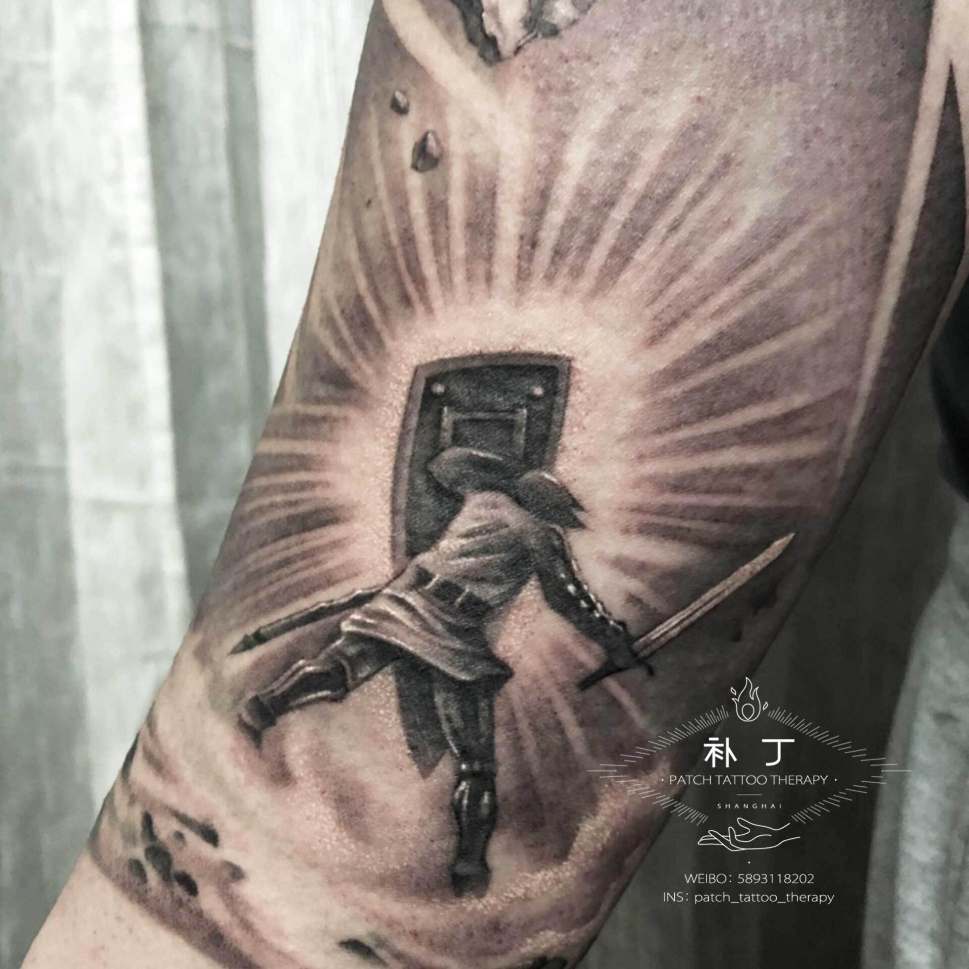 Full arm sleeve featuring a man fighting off meteors and comets with a lion portrait on the shoulder in black and grey realistic style designed by Jingxi Gu at Patch Tattoo Therapy - angle 4