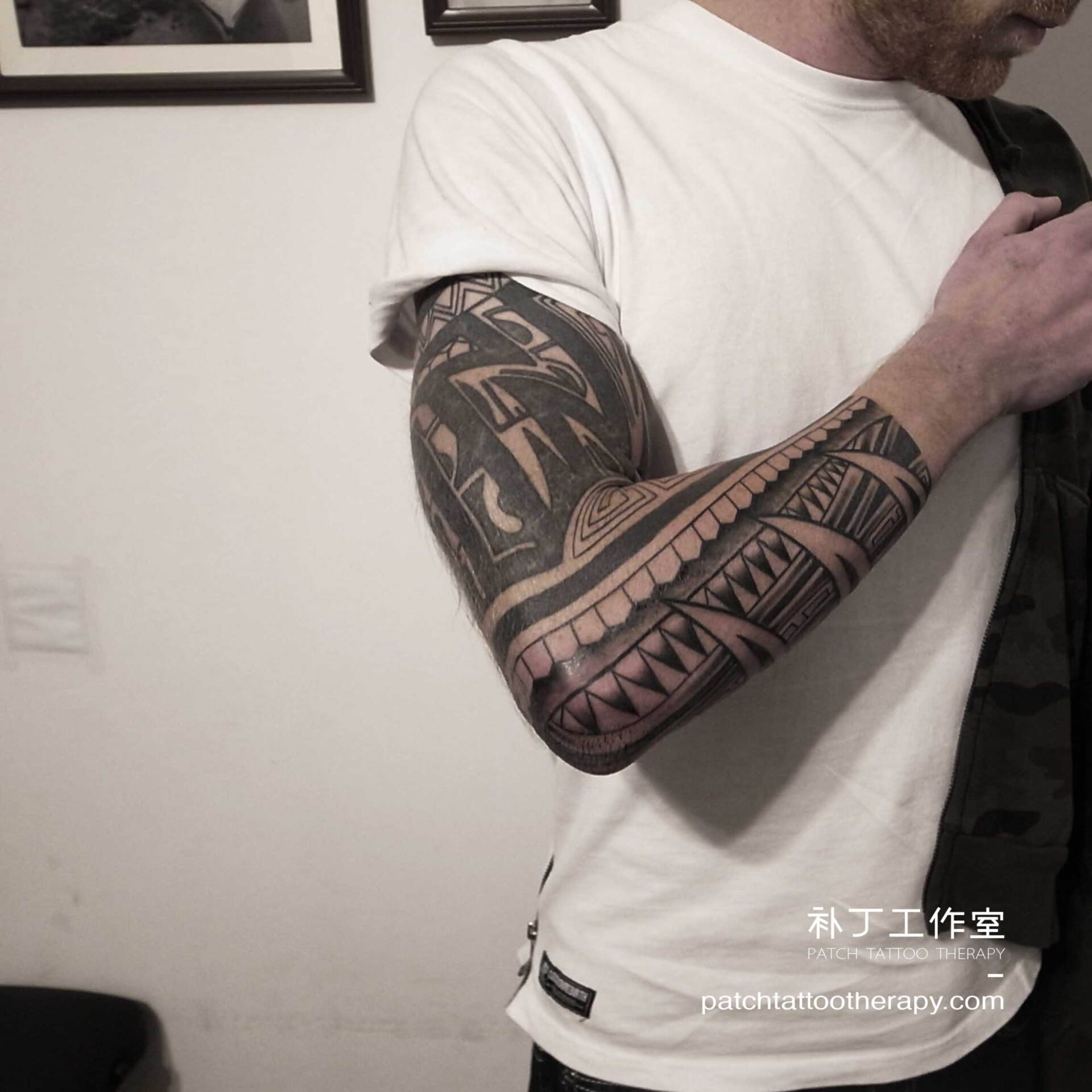 Full arm sleeve tattoo featuring a rope element in tribal style designed by Jingxi Gu at Patch Tattoo Therapy - angle 3