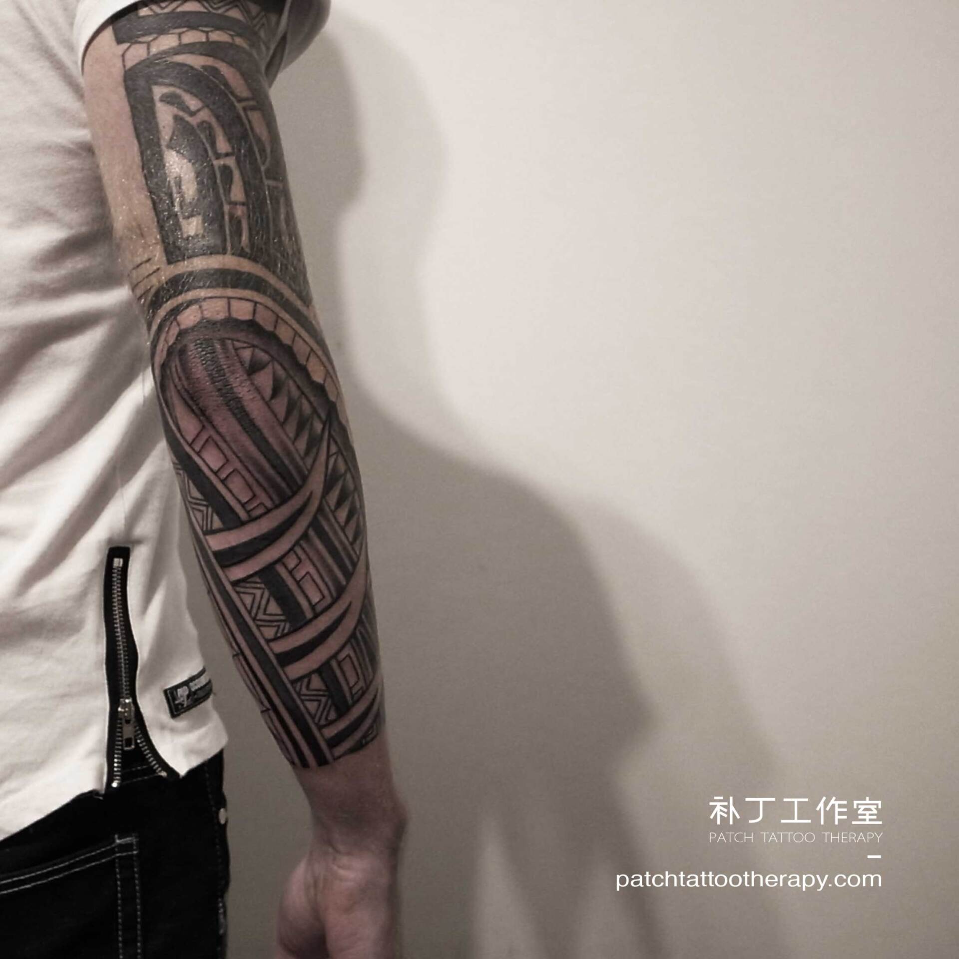 Full arm sleeve tattoo featuring a rope element in tribal style designed by Jingxi Gu at Patch Tattoo Therapy - angle 4