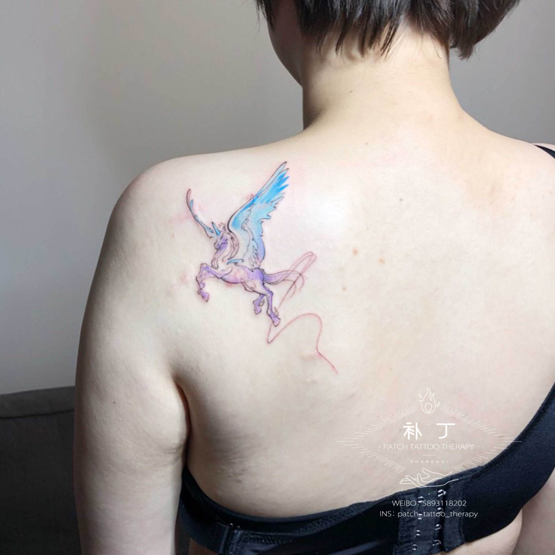 Back tattoo of a horse outline in color designed by Jingxi Gu at Patch Tattoo Therapy - angle 2