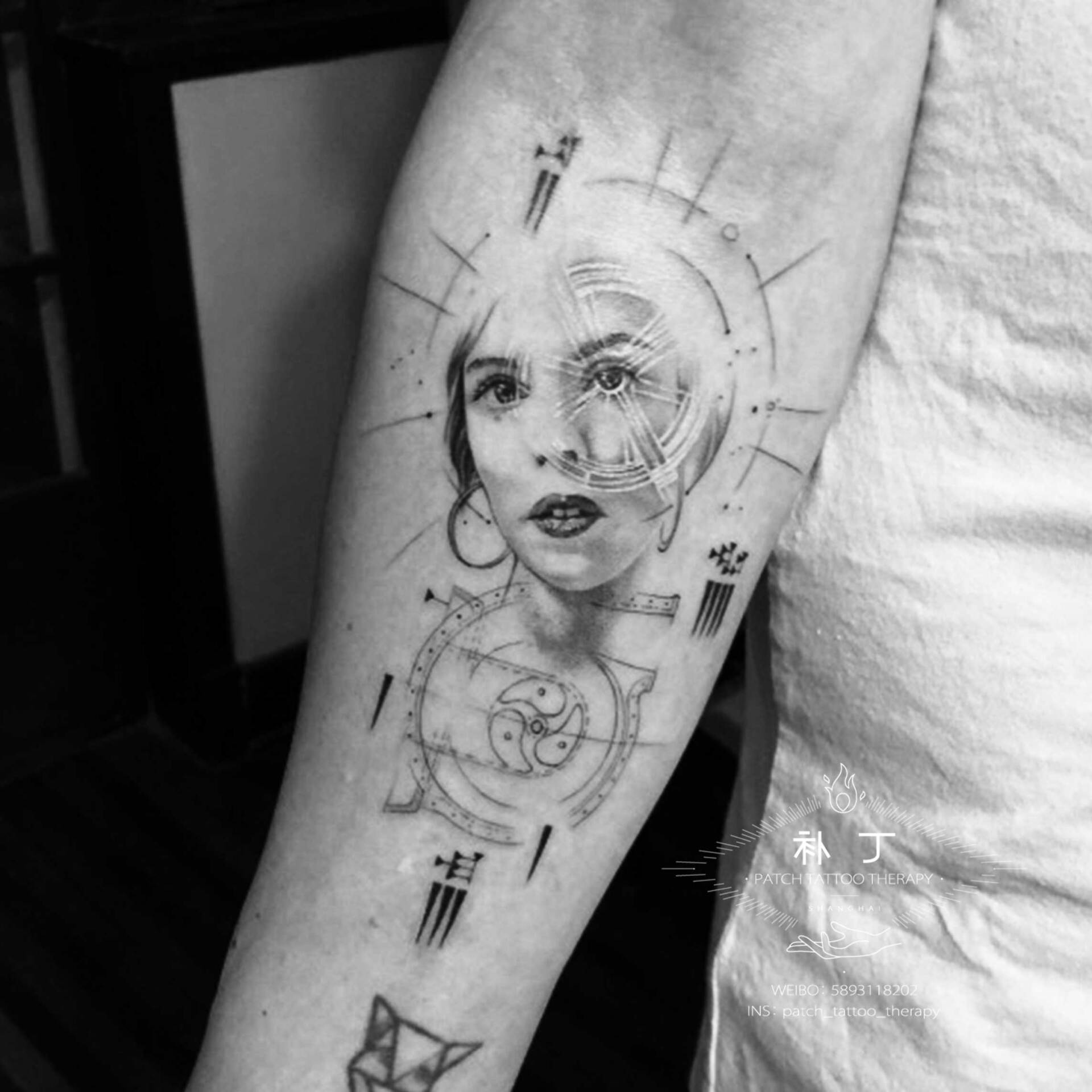 Inner forearm tattoo of a wife in portrait form with Nikola Tesla elements in geometric style designed by Jingxi Gu at Patch Tattoo Therapy