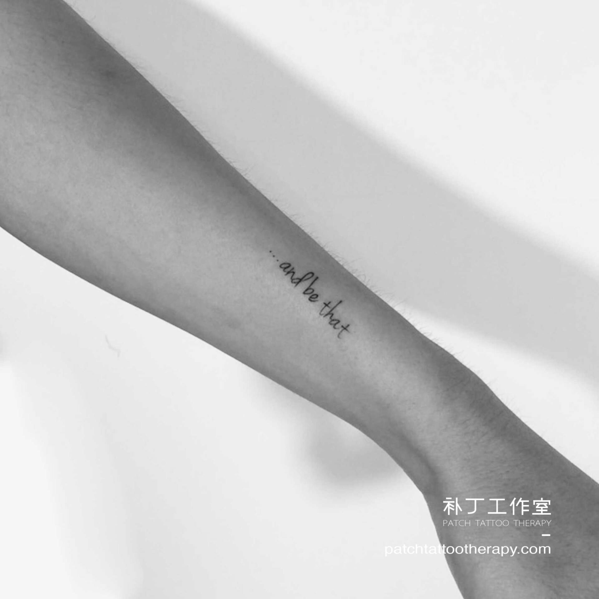 Forearm tattoo of letters 