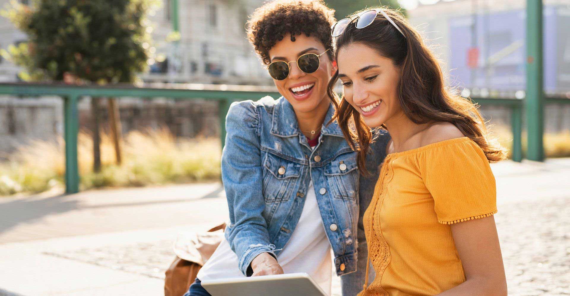 Woman Using Digital Tablet Outdoor — Fort Gratiot, MI — Hamzavi Dermatology & Dermatology Specialists