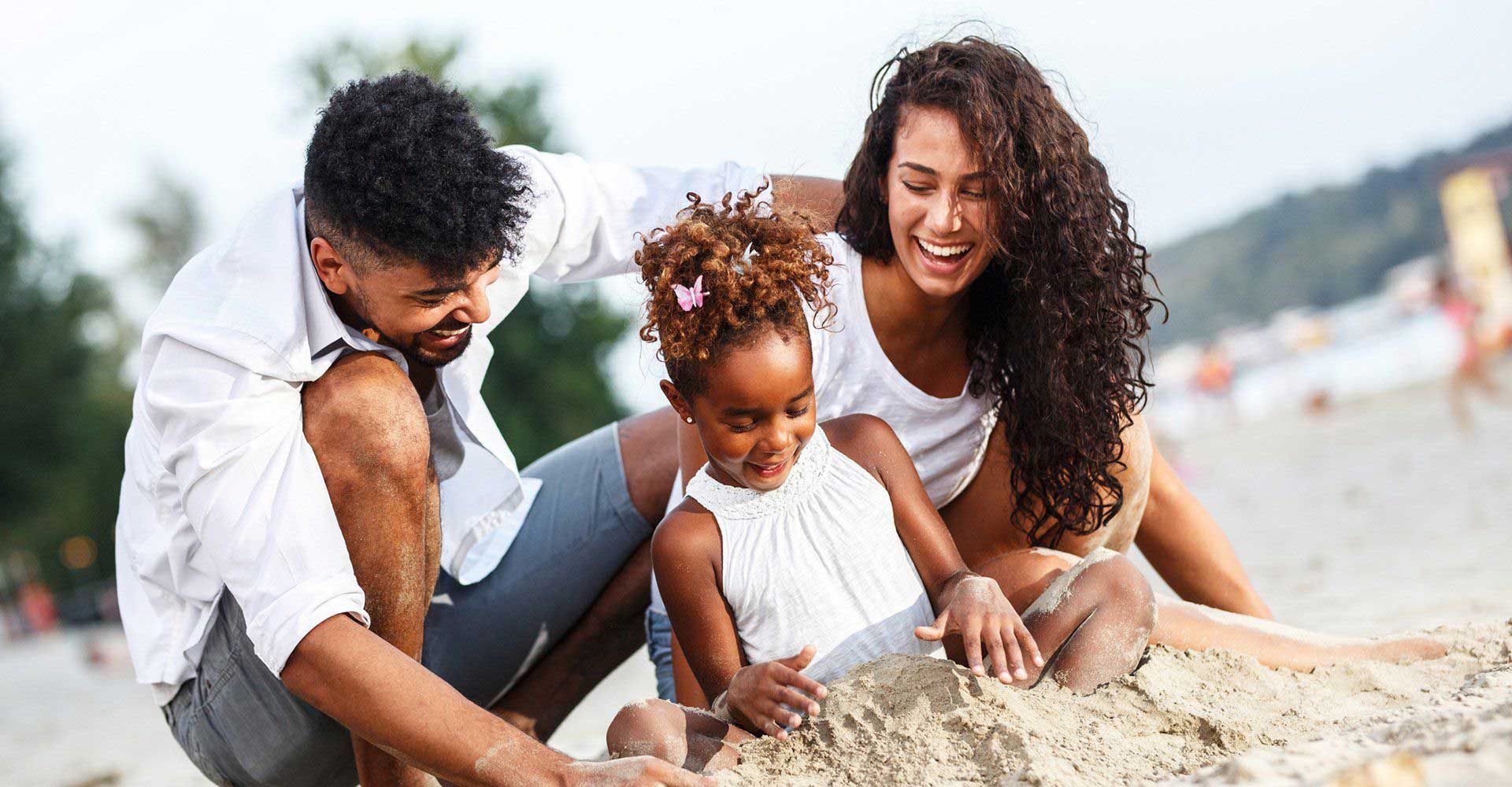 A family enjoying the beach after having skin cancer screening in Brighton, MI