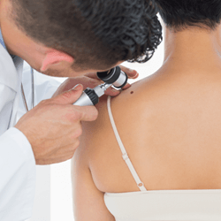 Male Doctor Examining the Patient's Shoulder — Fort Gratiot, MI — Hamzavi Dermatology & Dermatology Specialists
