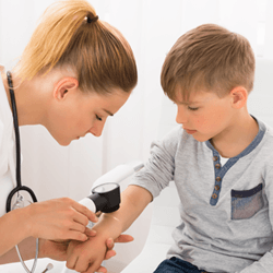 Doctor Checking Kid's Skin — Fort Gratiot, MI — Hamzavi Dermatology & Dermatology Specialists