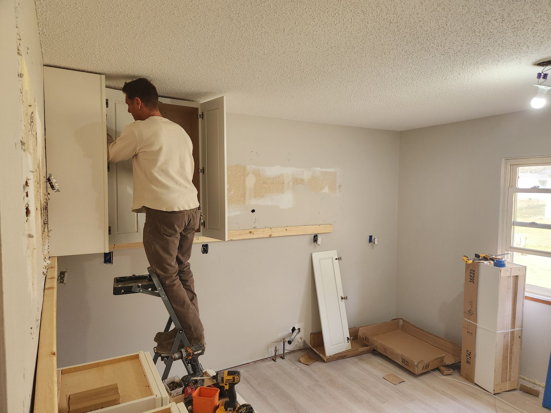 Staff Doing the Cabinet — O’Fallon, MO — Family Tree Homes