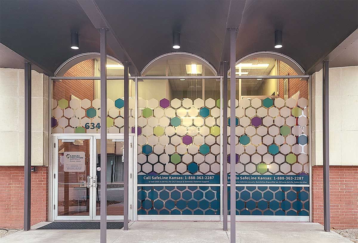 a colorful image of kcsdv building entrance with three stained glass windows
