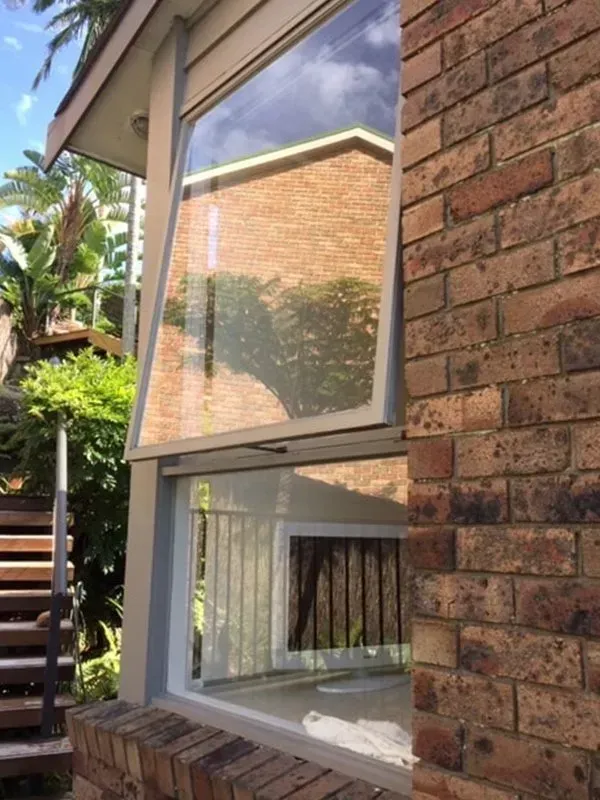 A Brick Building With A Window On The Side Of It — Avoca Beach Glass In West Gosford, NSW
