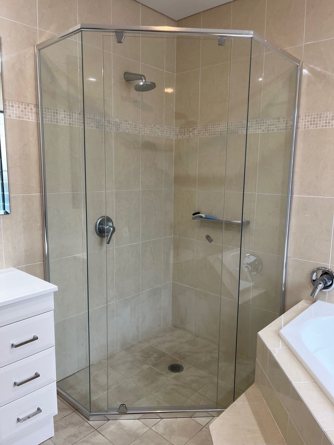 A bathroom with a shower stall and a sink — Avoca Beach Glass In West Gosford, NSW