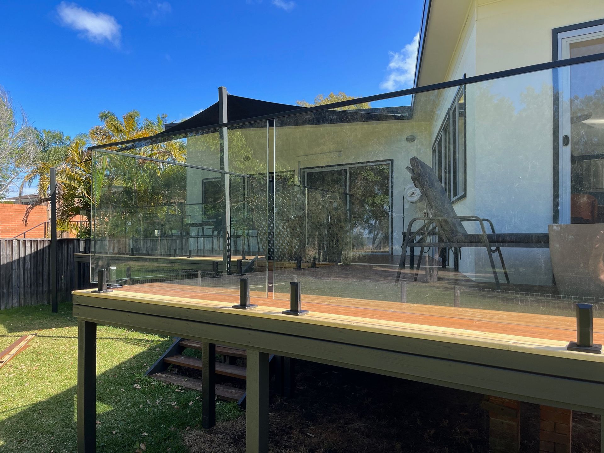 A Balcony With A Stainless Steel Railing And Frosted Glass — Avoca Beach Glass In Narrara, NSW
