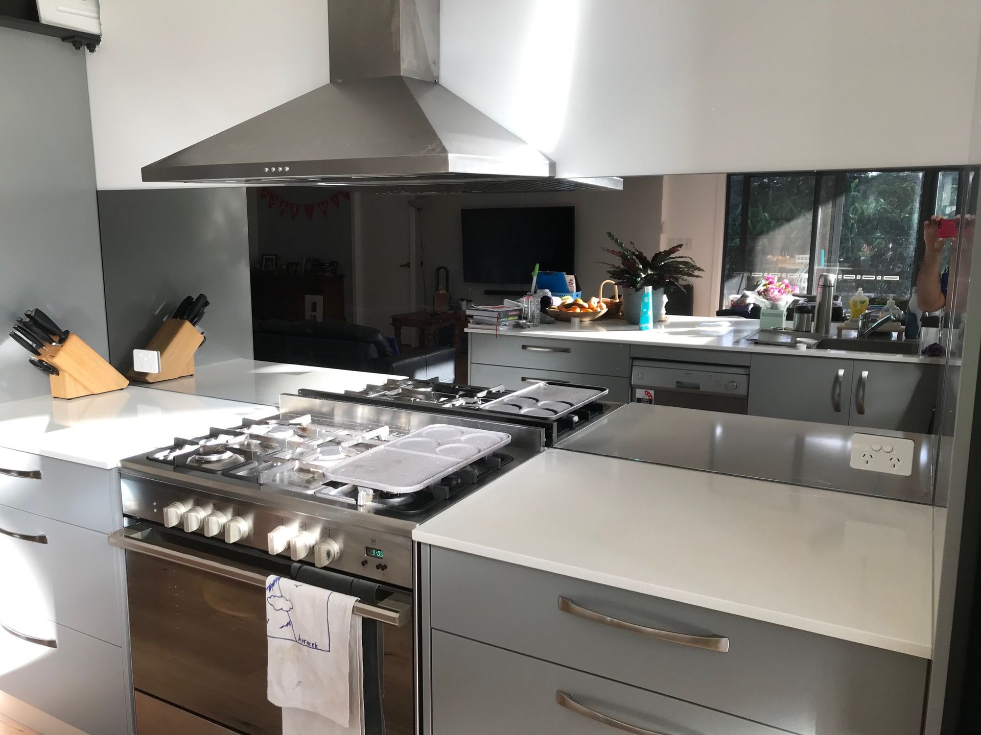 A Kitchen With Stainless Steel Appliances And White Counter Tops — Avoca Beach Glass In West Gosford, NSW