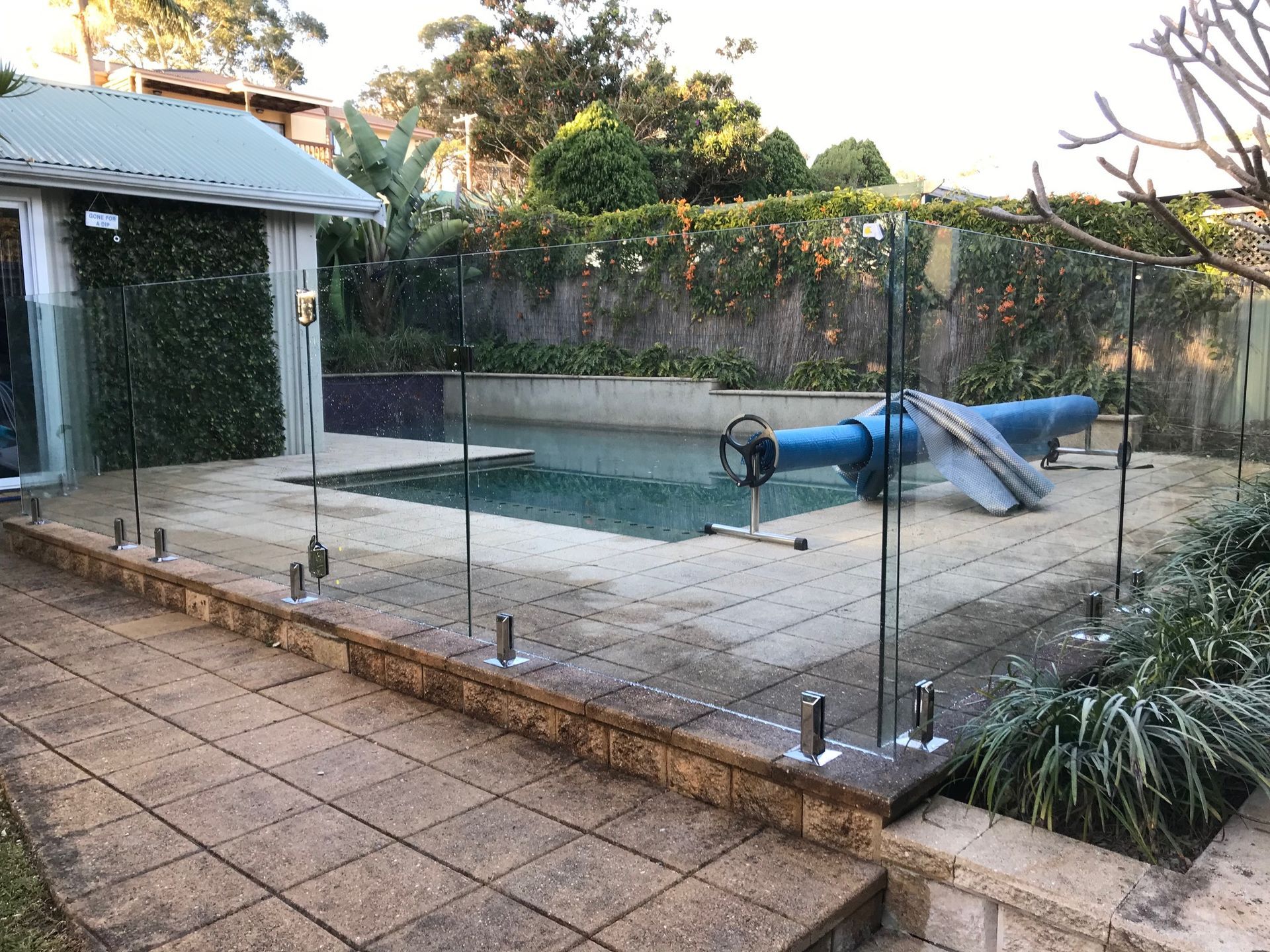 A Kitchen With Stainless Steel Appliances And White Counter Tops — Avoca Beach Glass In West Gosford, NSW