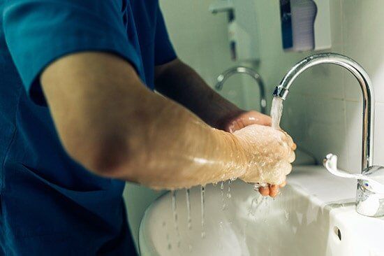 Medical Staff Washing Hands — Drug Testing And Training Solutions in Rockhampton, QLD
