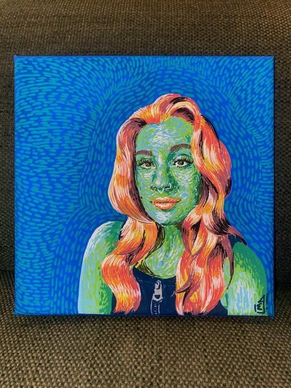 A green-skinned woman with red hair against a blue textured background.